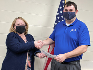 Amanda Hetrick receiving check