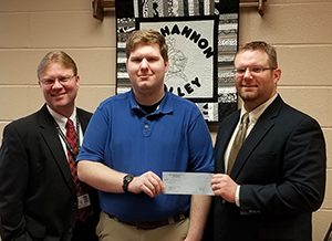 Superintendent Dr. John Zesiger and principal Kris Albright from Moshannon Valley School District present the teacher grant award to Mr. Al Gallo.