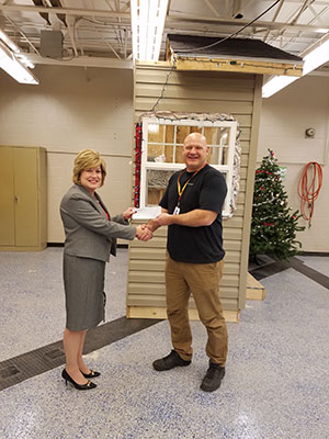 Mrs. Donna Miller, Superintendent, presenting the check to Mr. John Bochicchio, Girard High School Teacher.