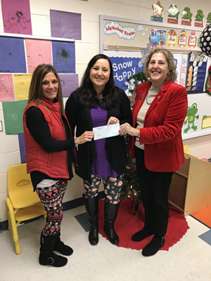 Kayla Graham and Kim Burda receiving PARSS grant check from Superintendent Dr. Barbara Parkins