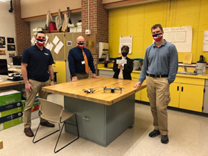 Patrick Lauletta, Colin Kolb, Principal Mike Brookes, and CTE Director Lisa McNamara accepting grant