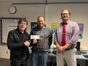 Left to right: Tim Bainey (board president), Tyler Good (teacher), Brian Pelka (Osceola Mills Elementary principal)